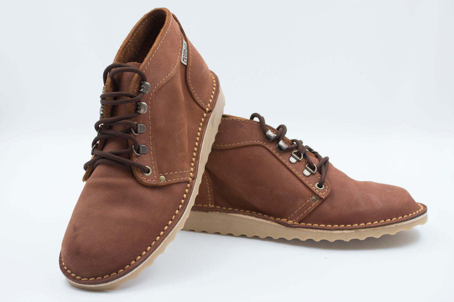 Tobacco Ranger boot pair showing full-grain leather texture and hiking-style lacing with crepe sole