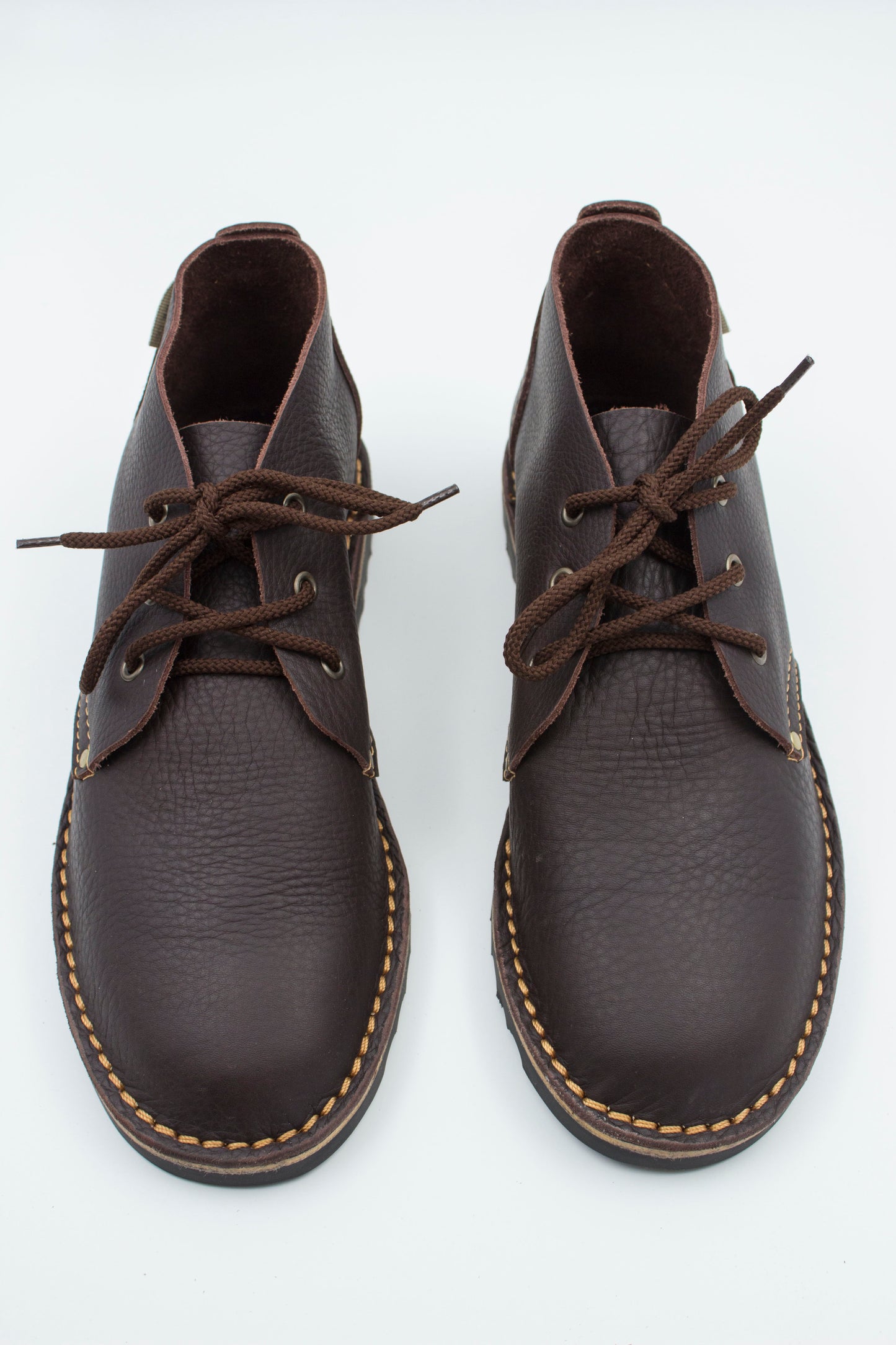 Top view of handmade high-cut veldskoen in medium darkleather showing ankle collar and interior