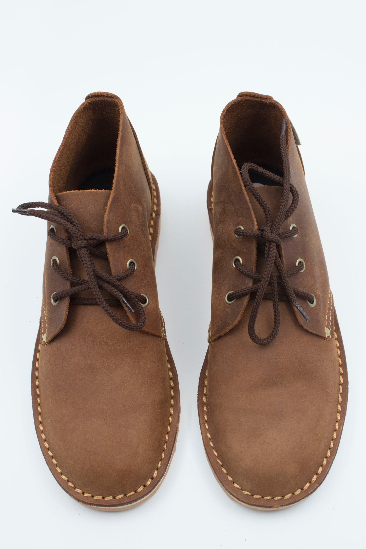 Top view of handmade high-cut veldskoen in medium brown leather showing ankle collar and interior