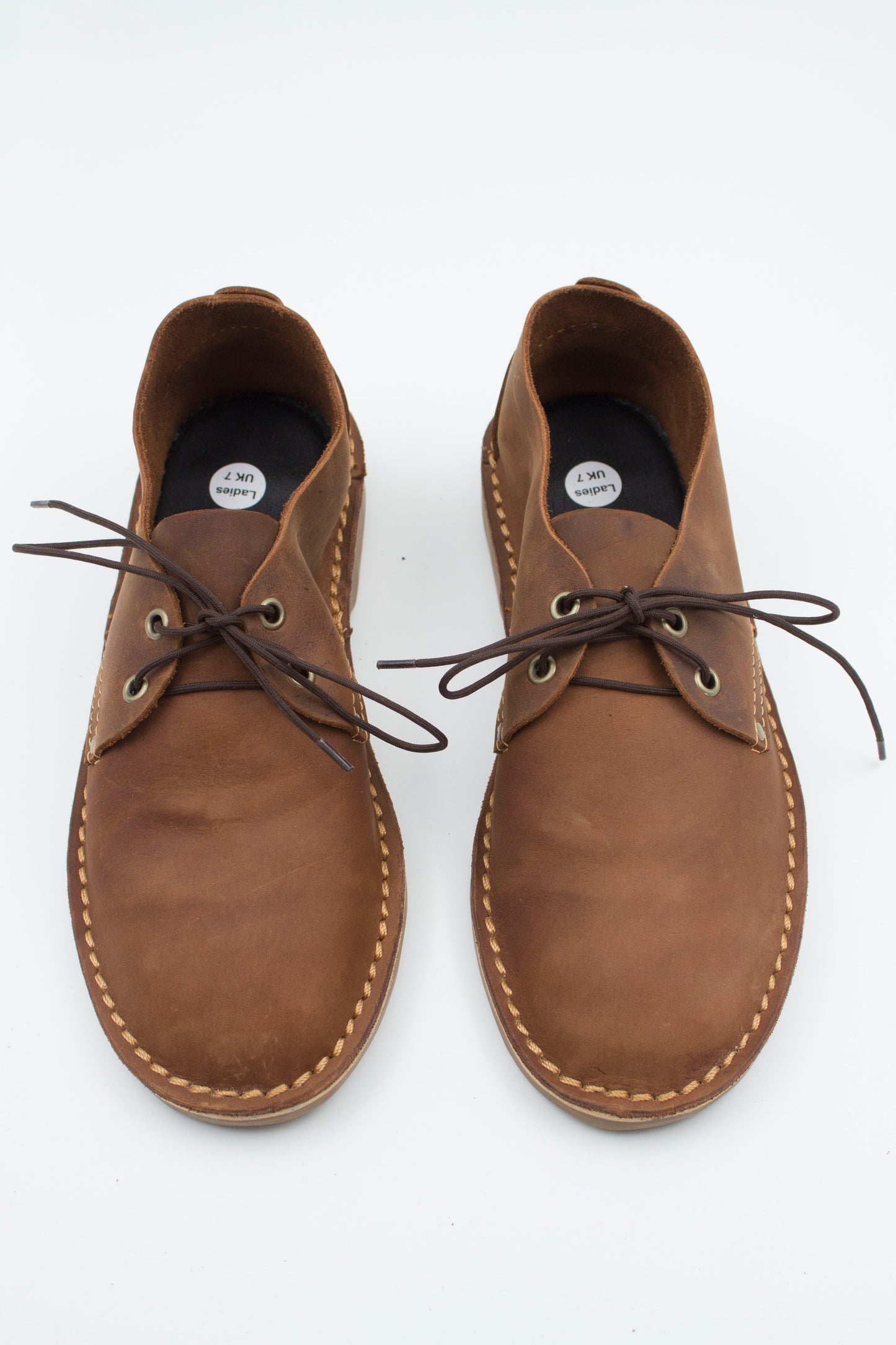 Top view of ladies velskoen pair in medium brown full-grain leather showing interior lining and laces