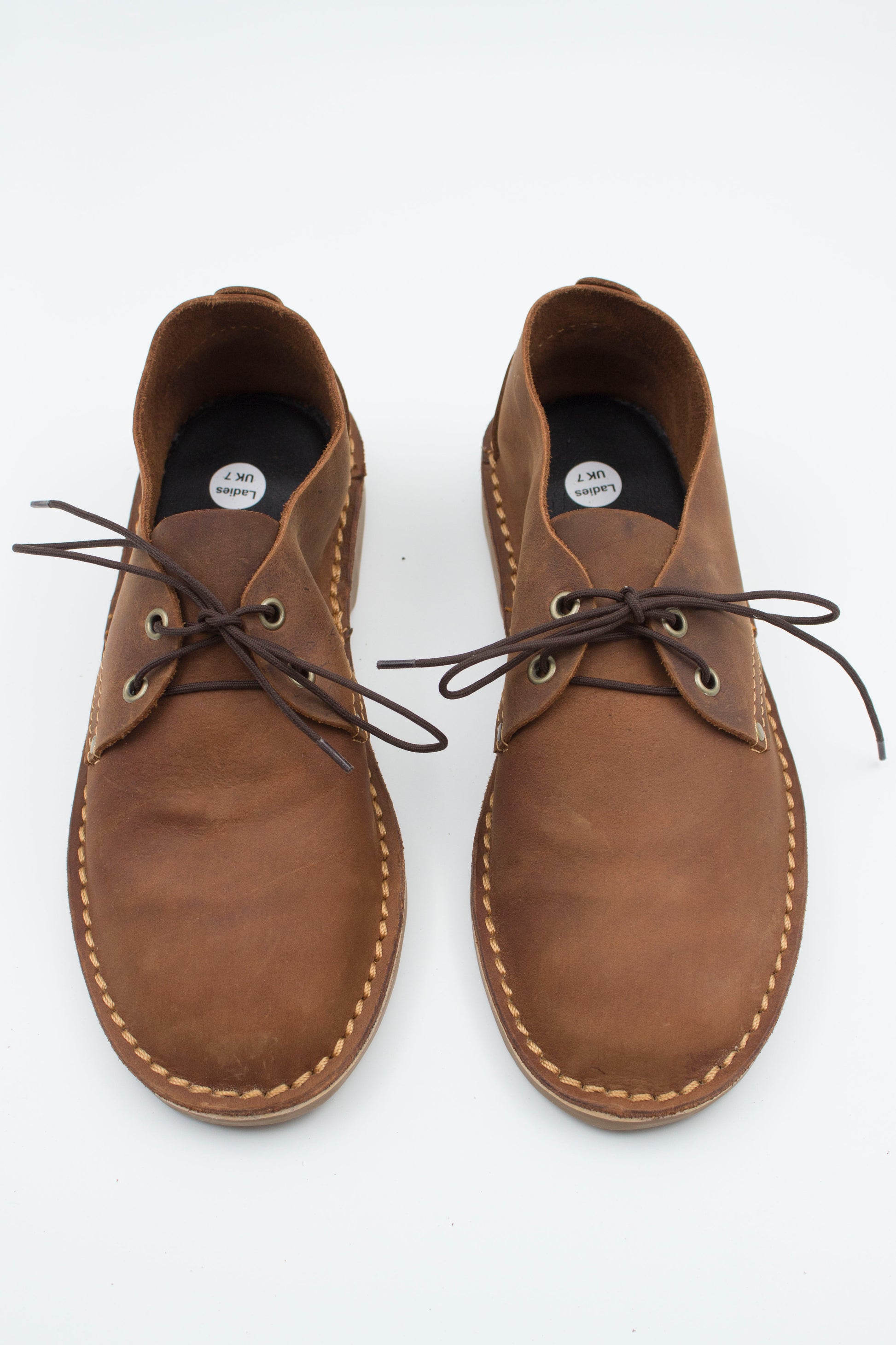 Top view of ladies velskoen pair in medium brown full-grain leather showing interior lining and laces