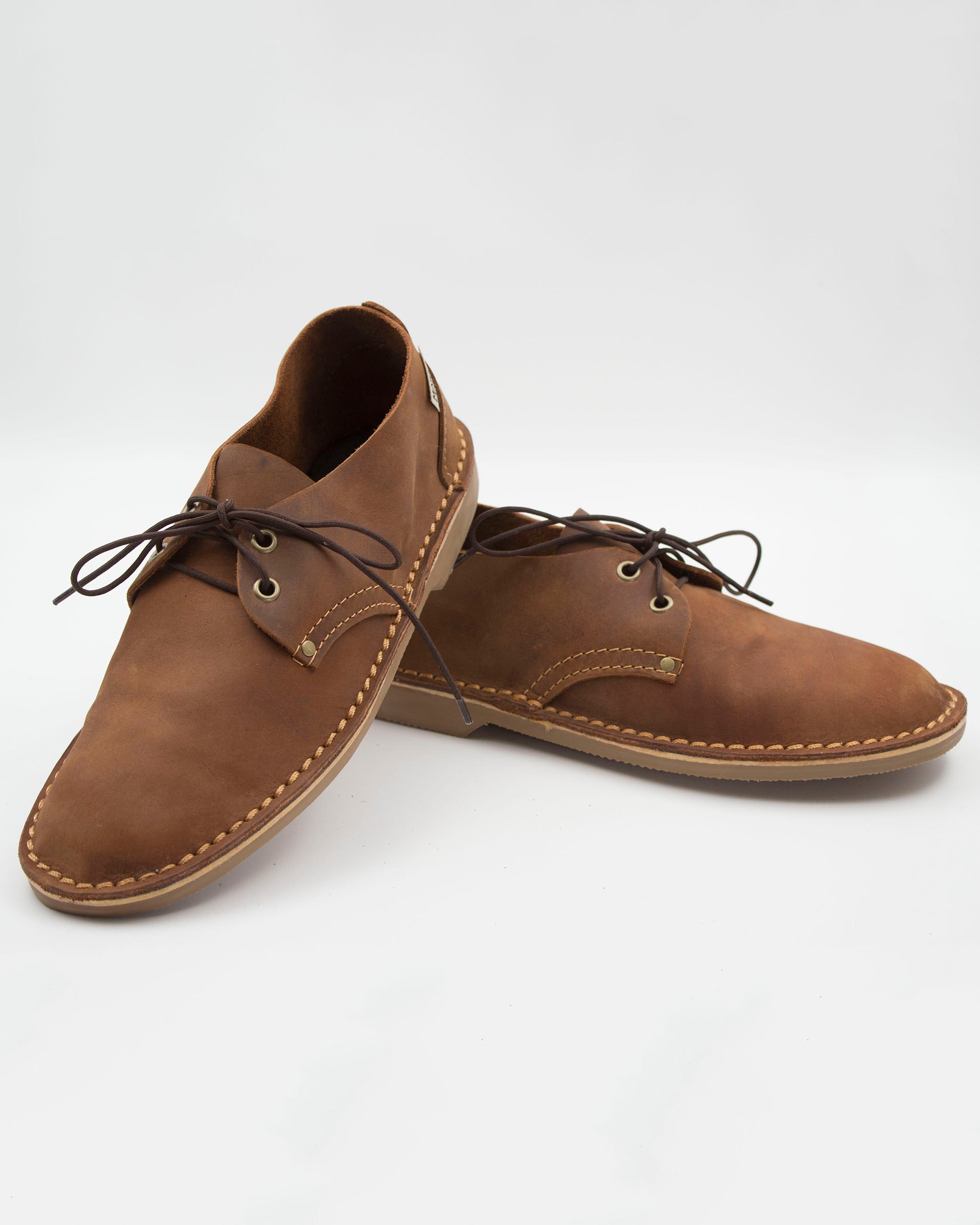 Medium brown ladies vedlskoen pair showing full-grain leather texture and Muddy Brown sole construction