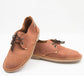 Tobacco ladies veldskoen pair showing full-grain leather texture and crepe sole construction