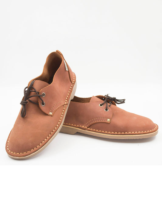 Tobacco ladies veldskoen pair showing full-grain leather texture and crepe sole construction
