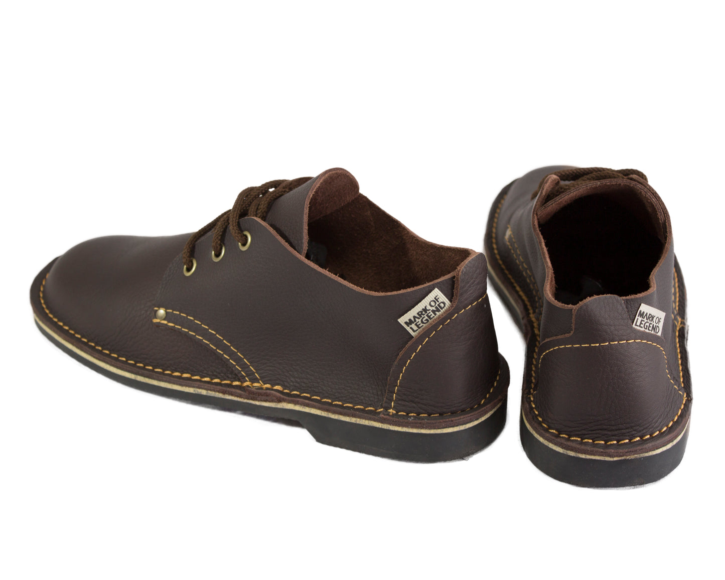 A pair of handmade dark brown vellies showing the back view