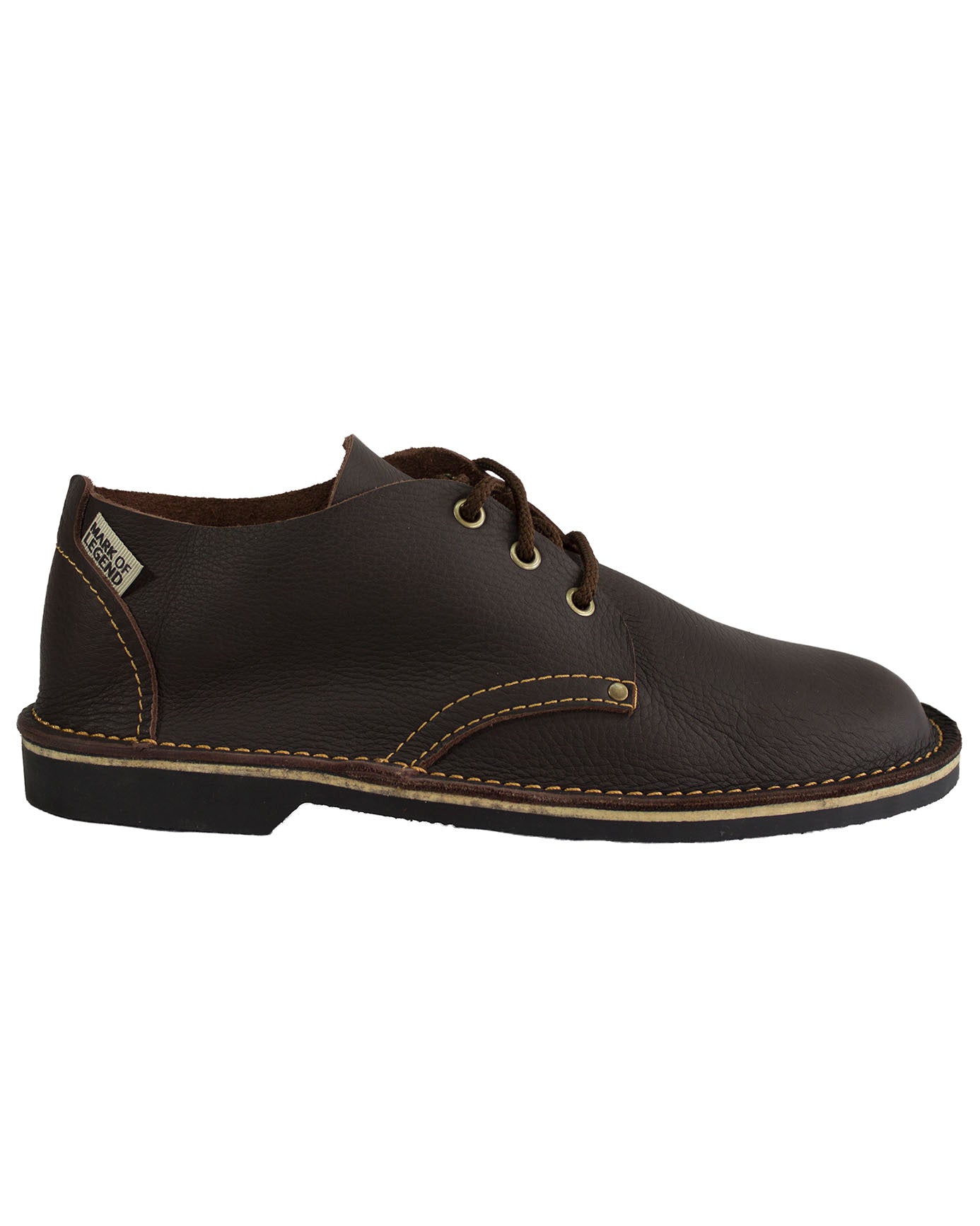 Side view of South African handmade low-cut veldskoen in dark brown leather with black sole