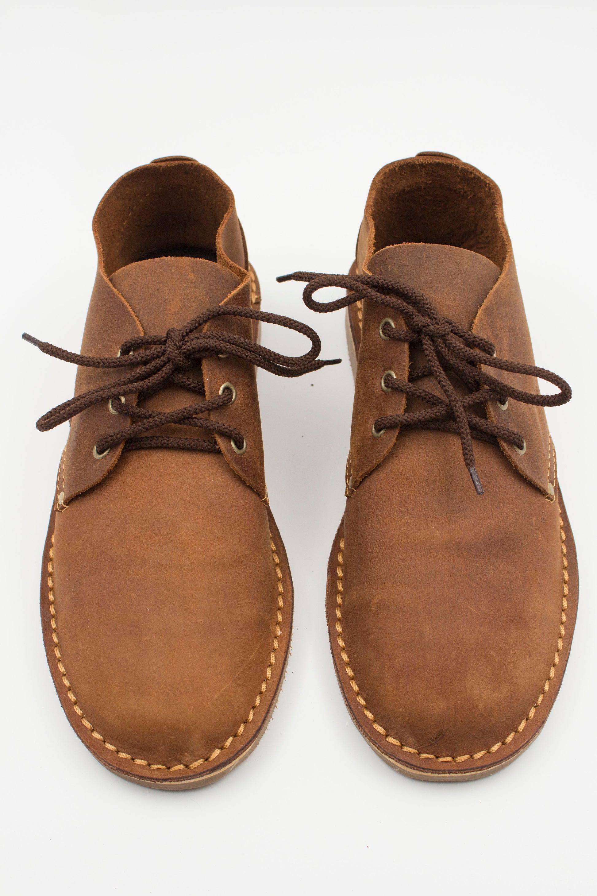 Top view of handmade low-cut veldskoen in medium brown leather showing interior lining and laces