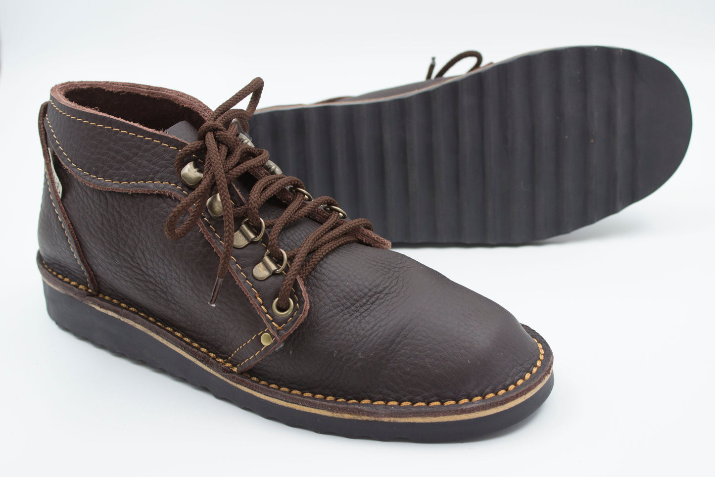 Ranger boot dark brown leather with durable black ridged sole showing deep tread pattern