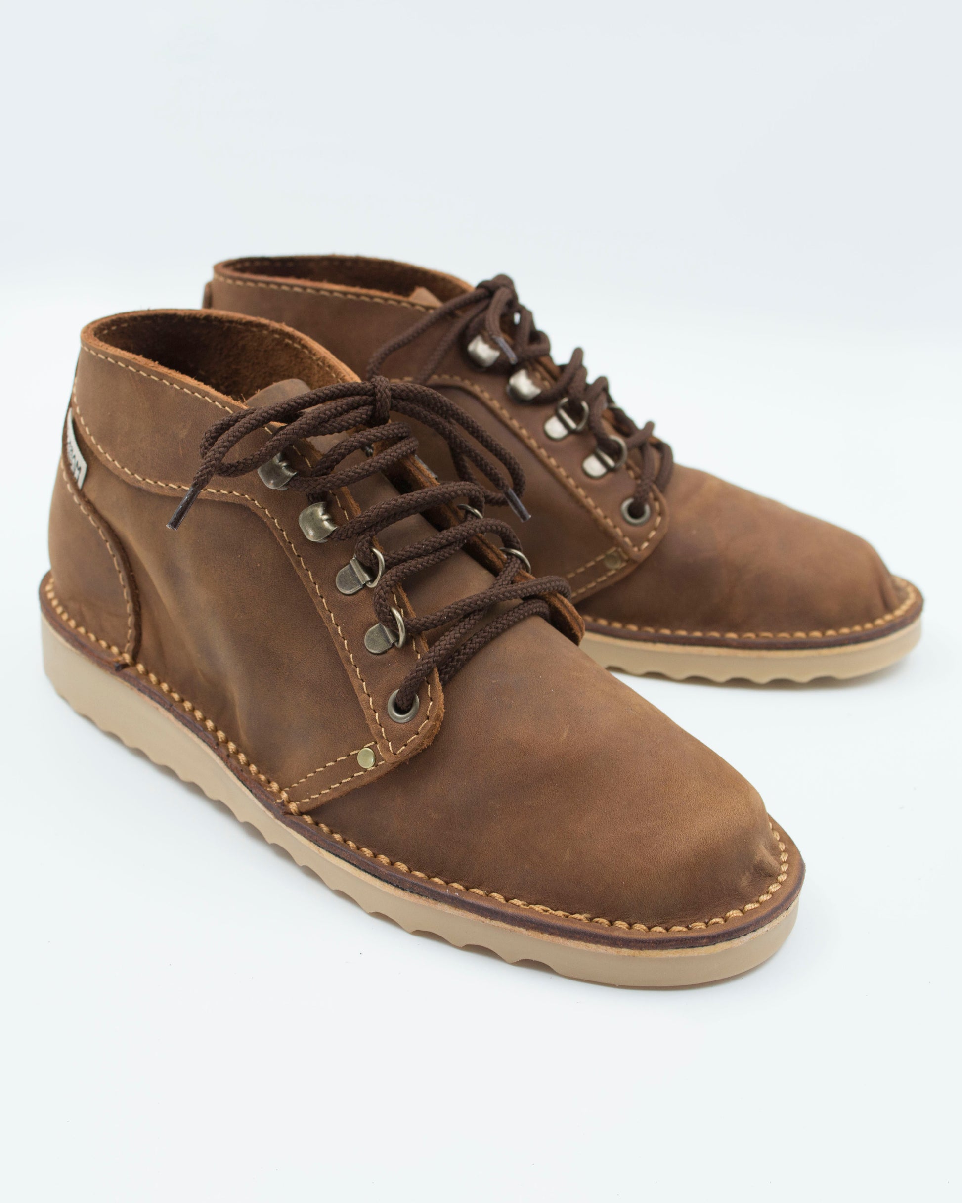 Handmade Ranger boot in medium brown full-grain leather with hiking-style lacing and crepe wedge sole