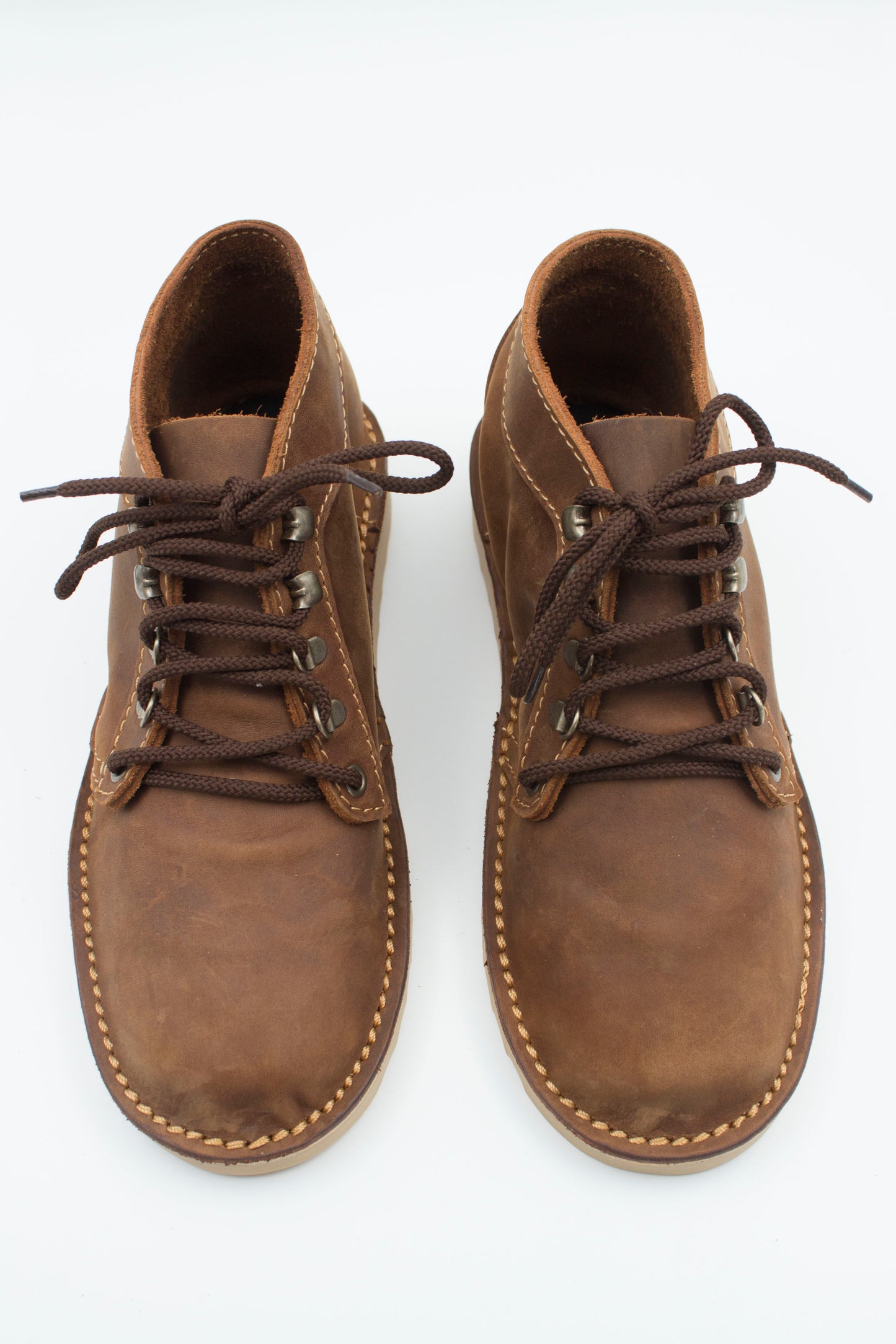 Top view of handmade Ranger boot in medium brown leather showing hiking eyelets and interior lining